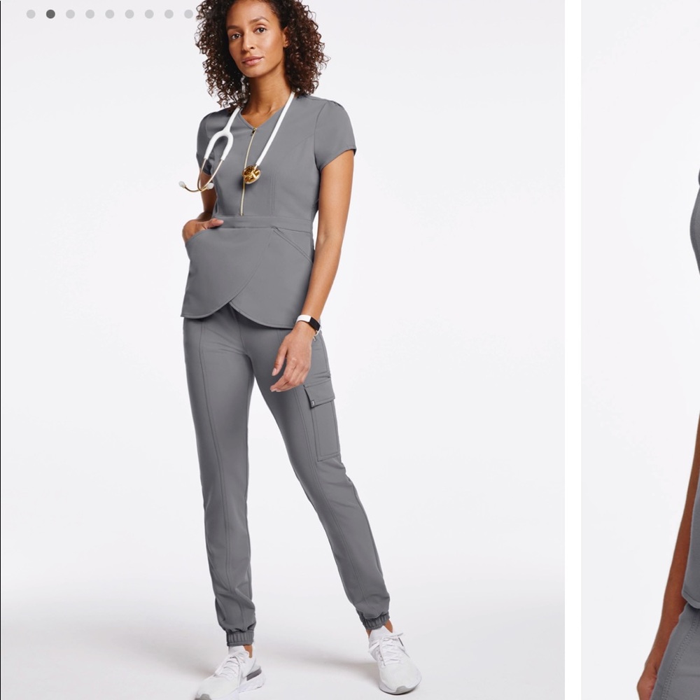 This tulip scrub top with standout gold hardware is very cute!